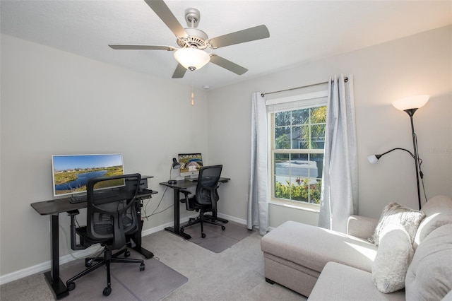 office area with light carpet and ceiling fan