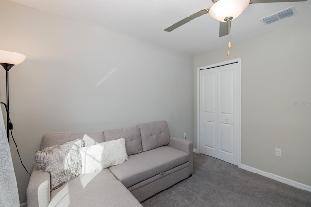 living room featuring carpet flooring and ceiling fan