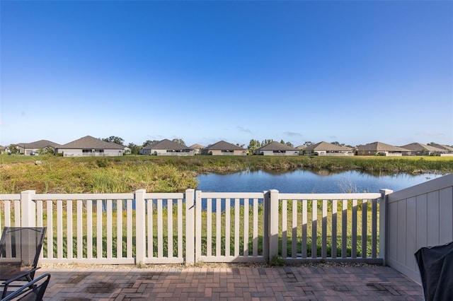 view of patio featuring a water view