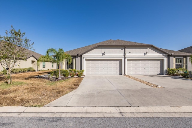 single story home featuring a garage