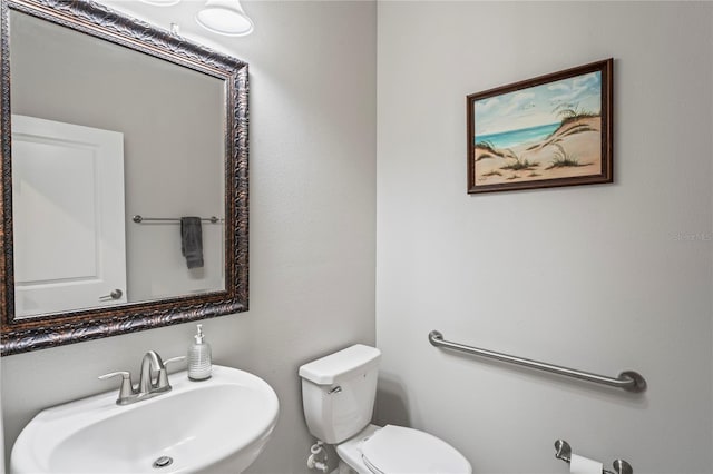 bathroom with toilet and sink