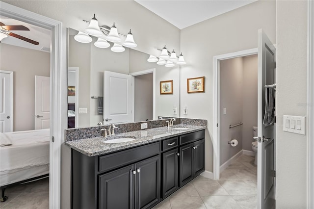 bathroom featuring tile patterned floors, ceiling fan, toilet, and vanity