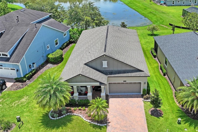 drone / aerial view with a water view