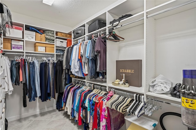 walk in closet featuring light tile patterned floors