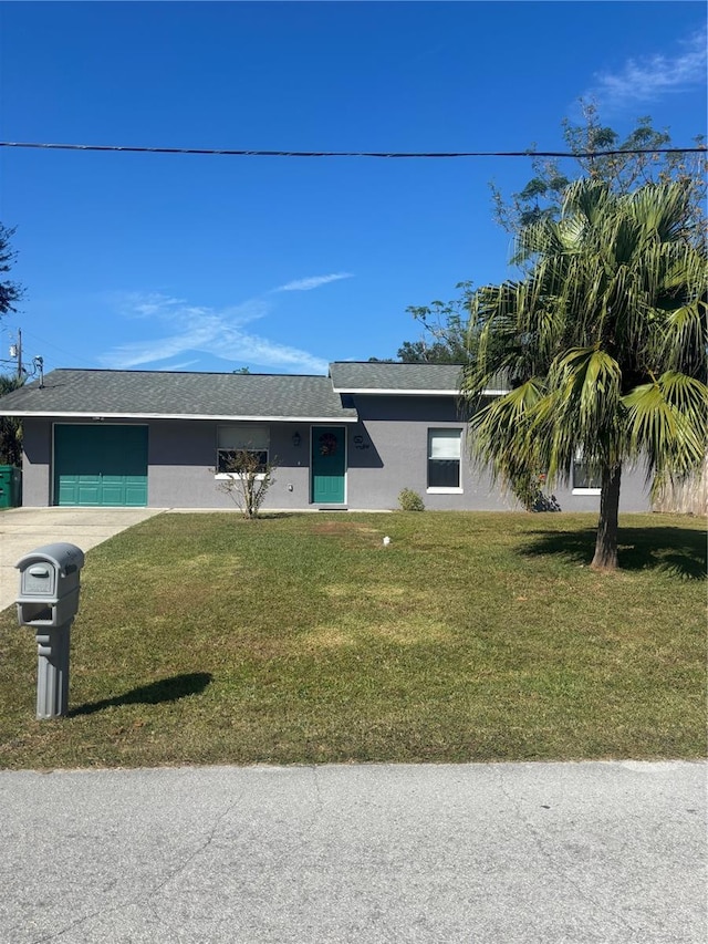 single story home with a front lawn and a garage