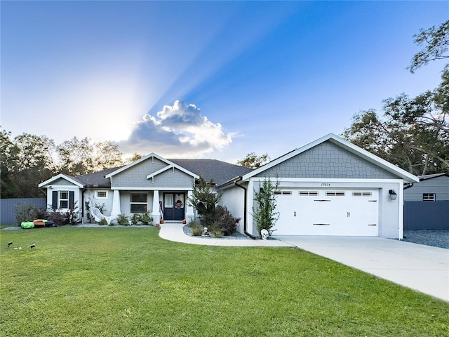 craftsman-style house with a front yard and a garage