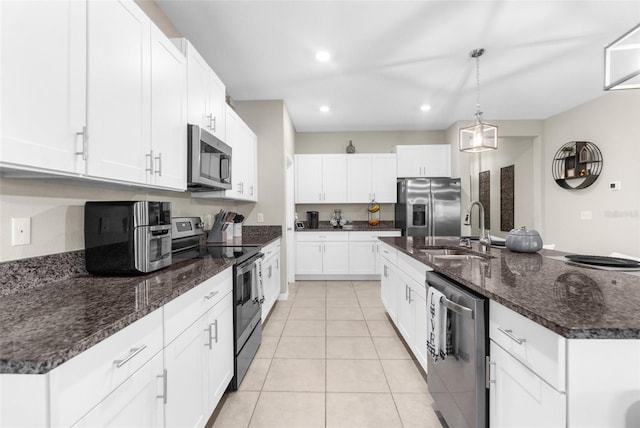 kitchen featuring white cabinetry, stainless steel appliances, and sink