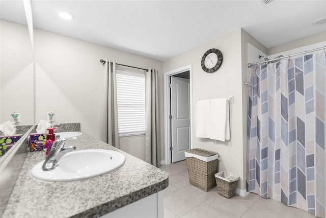 bathroom with vanity, a shower with curtain, and tile patterned flooring