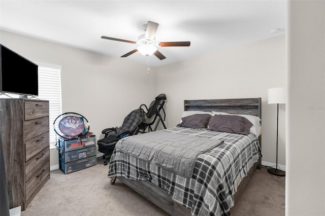 bedroom with light carpet and ceiling fan