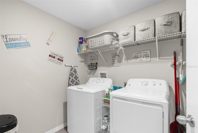 washroom with washing machine and clothes dryer