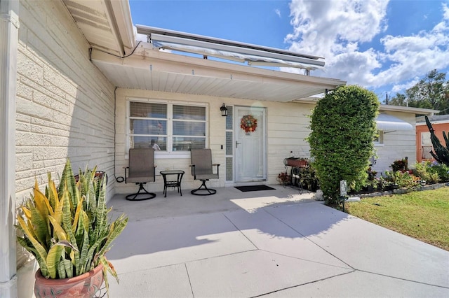 doorway to property with a patio