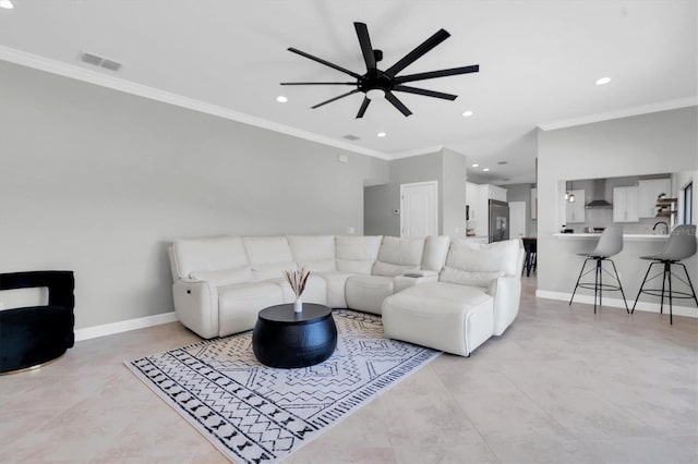 living room featuring crown molding and ceiling fan