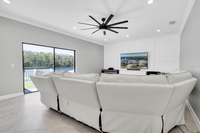 tiled living room featuring crown molding and ceiling fan