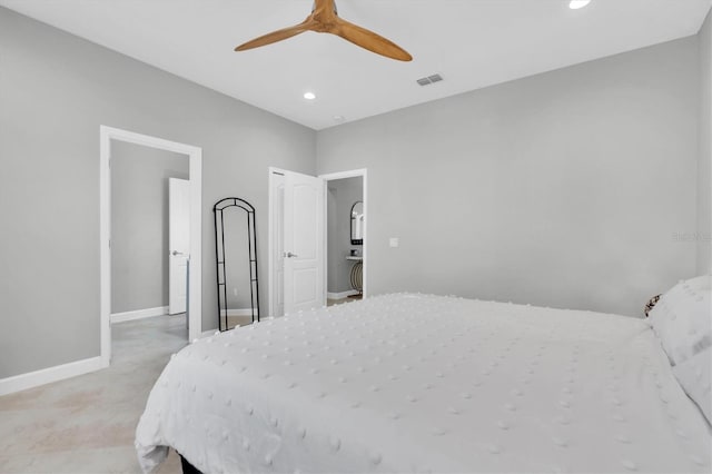 bedroom with ceiling fan and light carpet