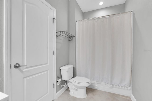 bathroom with toilet and shower / bath combo