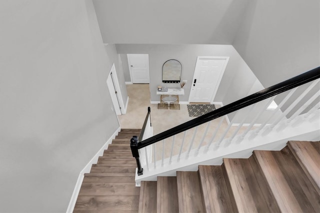 stairway featuring hardwood / wood-style floors