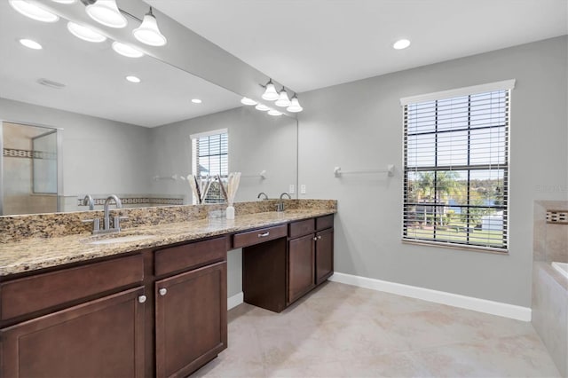 bathroom with vanity and a bathing tub