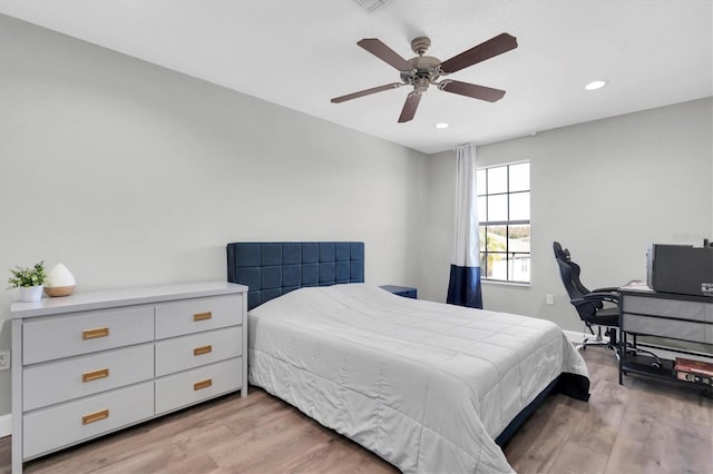 bedroom featuring light wood-type flooring and ceiling fan