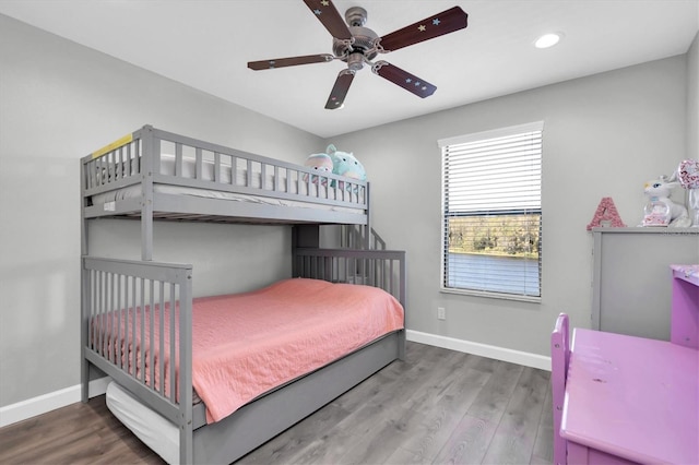 bedroom featuring ceiling fan and hardwood / wood-style floors