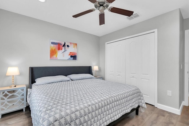 bedroom featuring a closet, ceiling fan, and hardwood / wood-style flooring