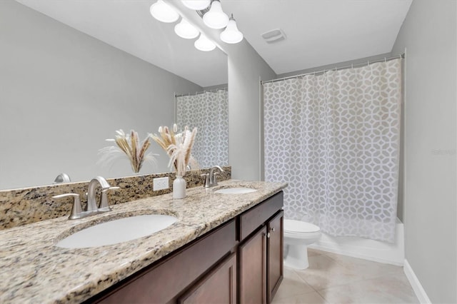 full bathroom featuring vanity, shower / bath combo with shower curtain, toilet, and tile patterned flooring