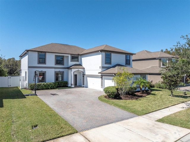 view of front of home featuring a front lawn and a garage