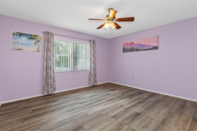 unfurnished room featuring wood-type flooring and ceiling fan