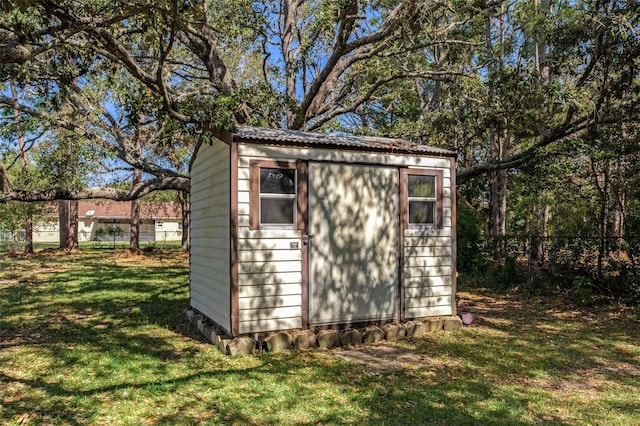 view of outbuilding with a lawn