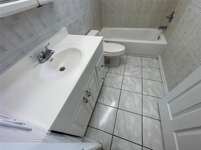 full bathroom with vanity, toilet, tile patterned floors, and  shower combination