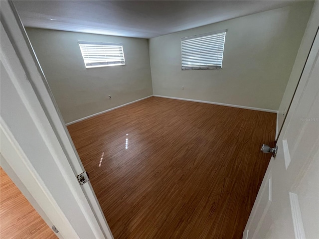 unfurnished room featuring wood-type flooring