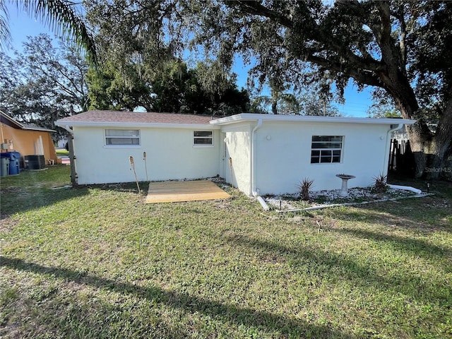 back of house with a yard