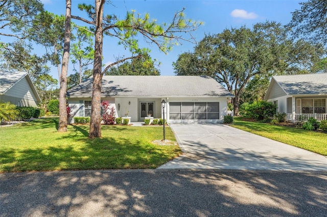 ranch-style house with a front yard and a garage