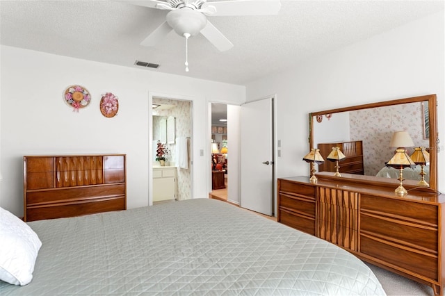 carpeted bedroom with connected bathroom, a textured ceiling, and ceiling fan