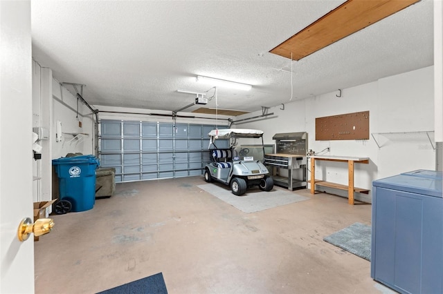 garage with washer / dryer and a garage door opener