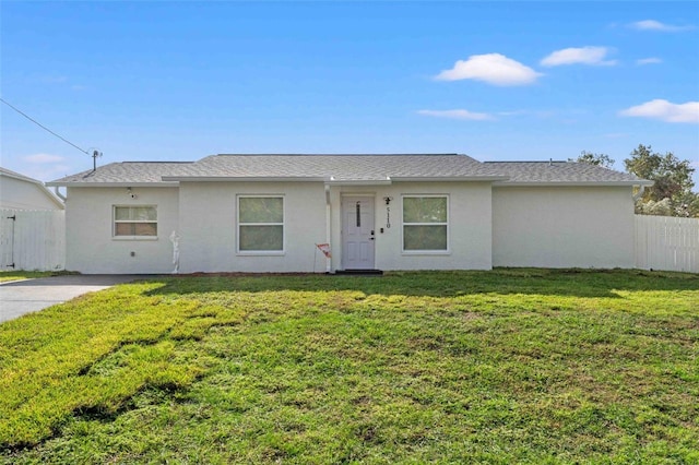 ranch-style house with a front lawn