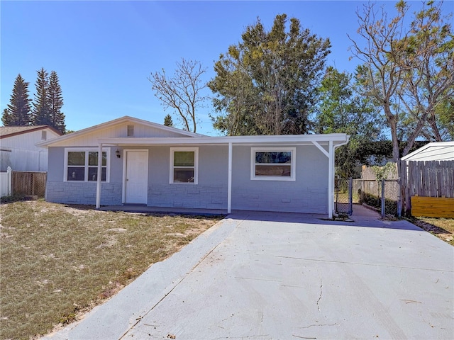 ranch-style home with a front lawn