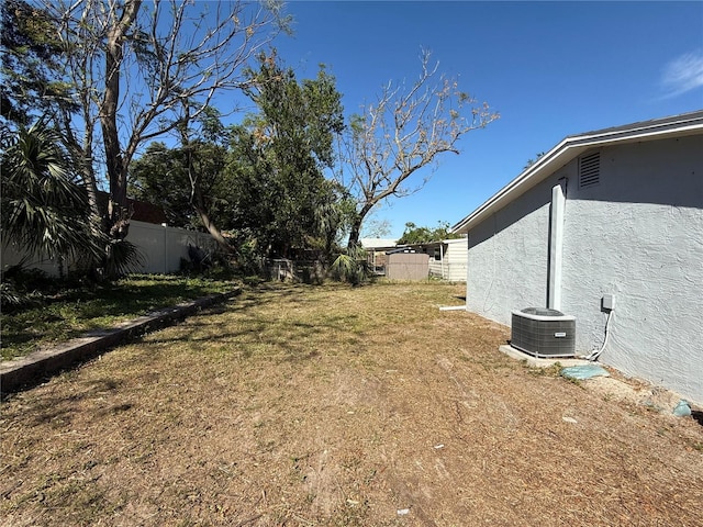 view of yard featuring central AC