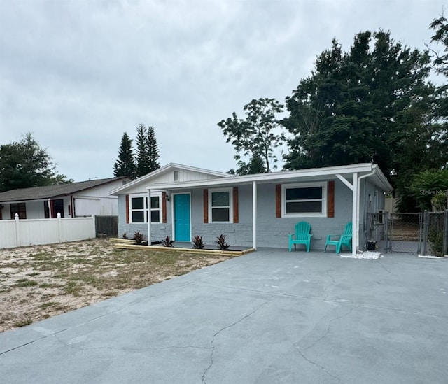 4041 Las Vegas Dr, New Port Richey, FL 34653 - ranch-style home featuring a gate and stone siding