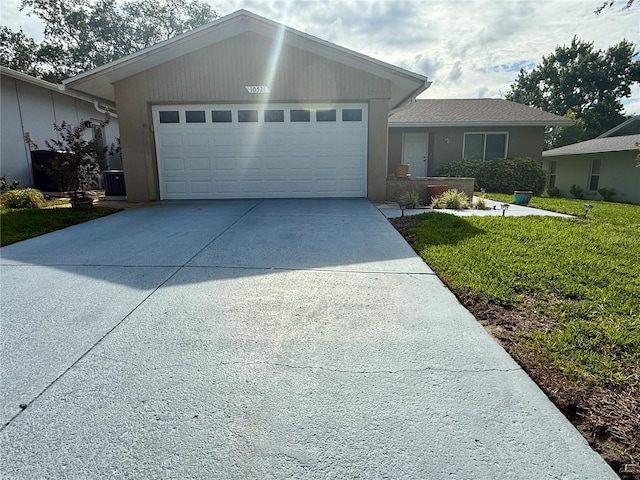 10521 Mira Vista Dr, Port Richey, FL 34668 - ranch-style home featuring a garage, driveway, and a front lawn