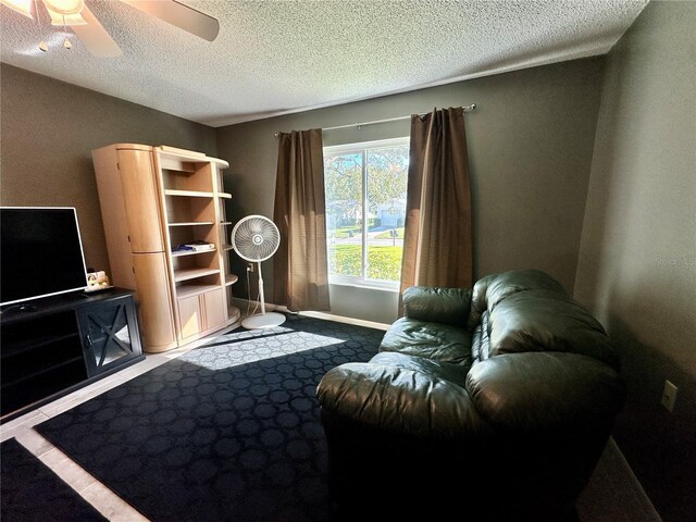 10521 Mira Vista Dr, Port Richey, FL 34668 - living room featuring a textured ceiling and ceiling fan