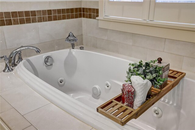 bathroom featuring a relaxing tiled tub