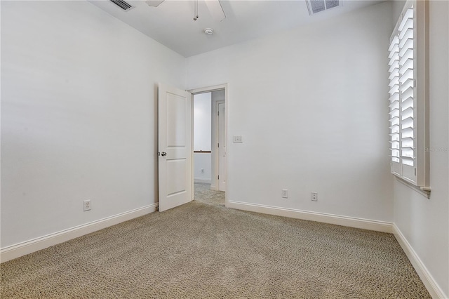 unfurnished room with carpet and ceiling fan