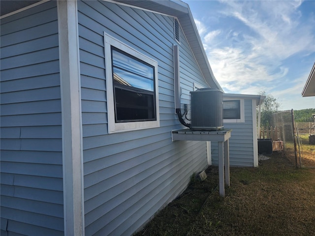 view of side of property with cooling unit