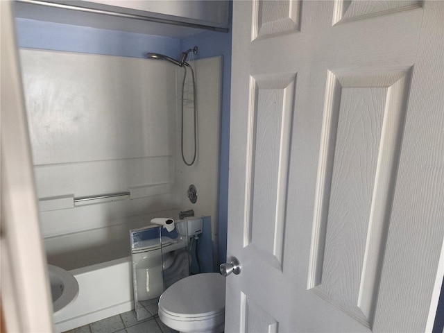 bathroom featuring tile patterned floors, toilet, and shower / bath combination