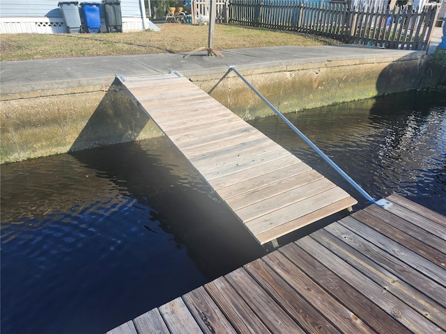 dock area featuring a water view