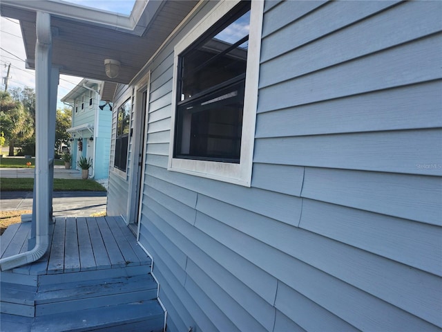 view of side of property with a porch