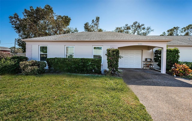 single story home featuring a garage, a front lawn, and a carport