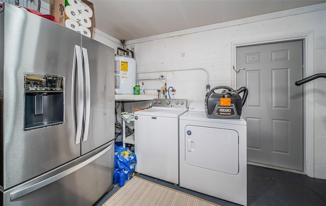 clothes washing area with electric water heater and washing machine and clothes dryer