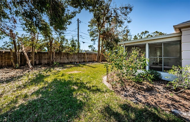 view of yard featuring a sunroom