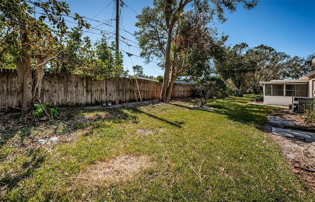 view of yard with a sunroom